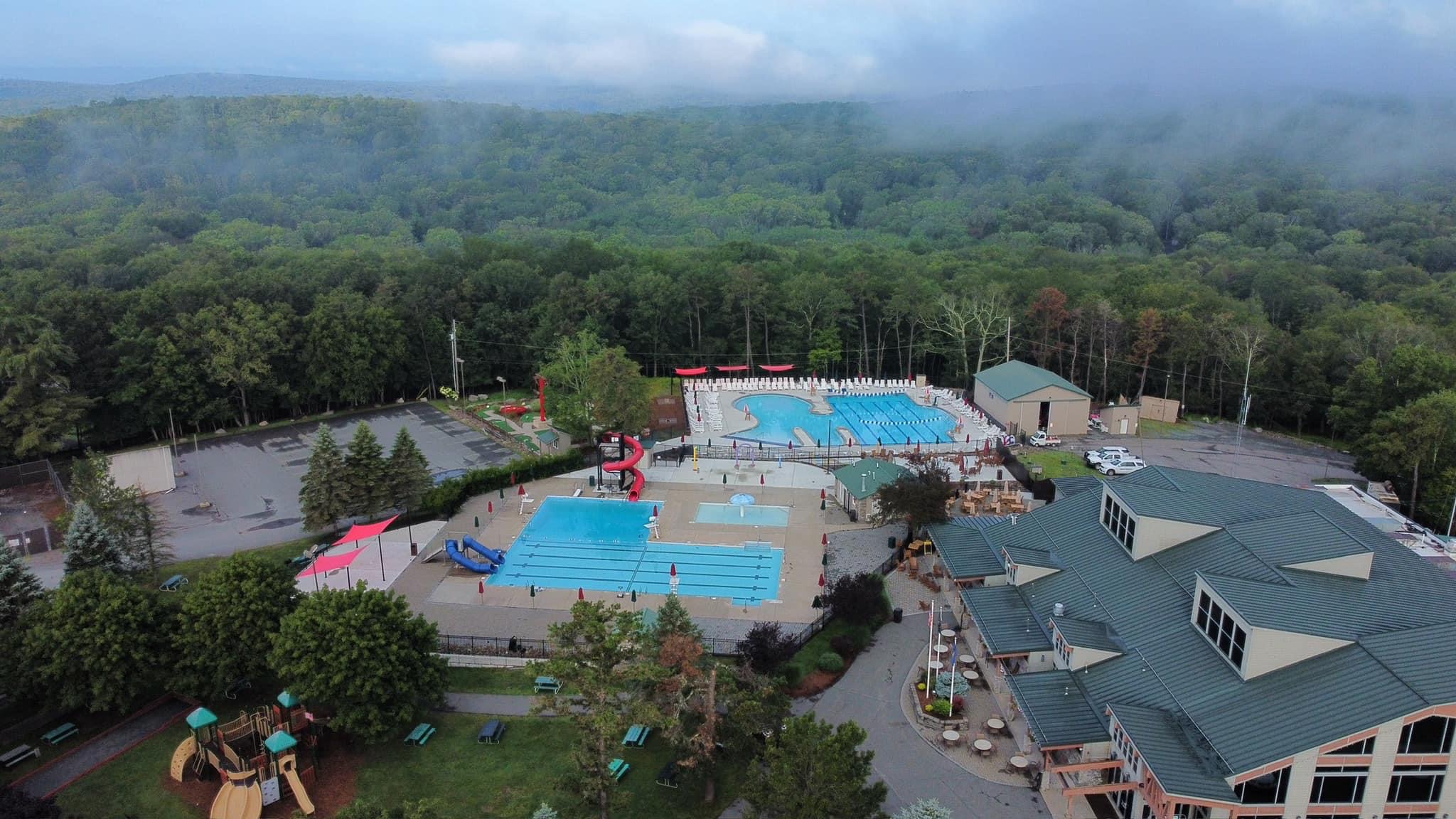 Resort-style community with multiple pools, splash pad, tiki bar & waterslides